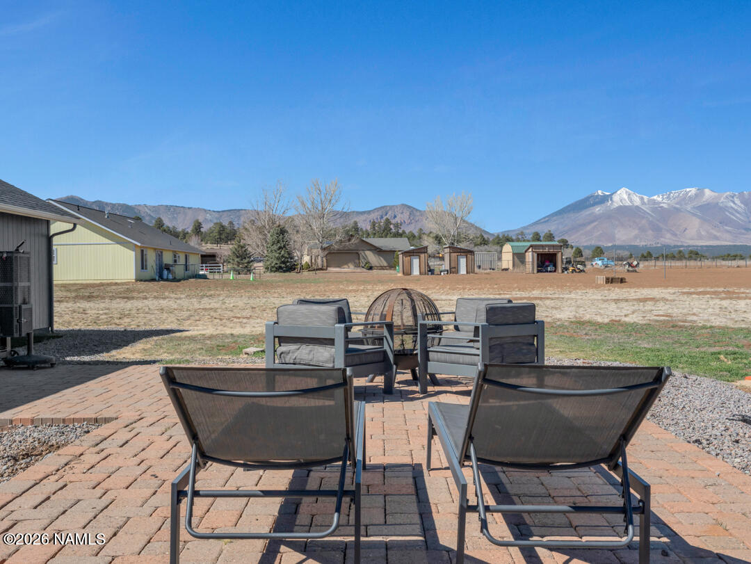 8115 Fawn Run Road Flagstaff, AZ 86004 - Photo 23 of 26 a view of a balcony with table and chairs