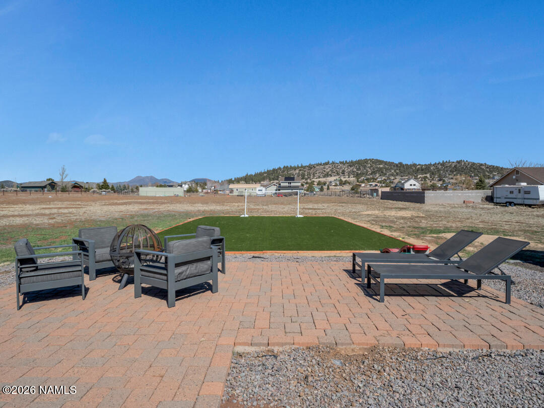 8115 Fawn Run Road Flagstaff, AZ 86004 - Photo 24 of 26 a park view with a bench and lake view