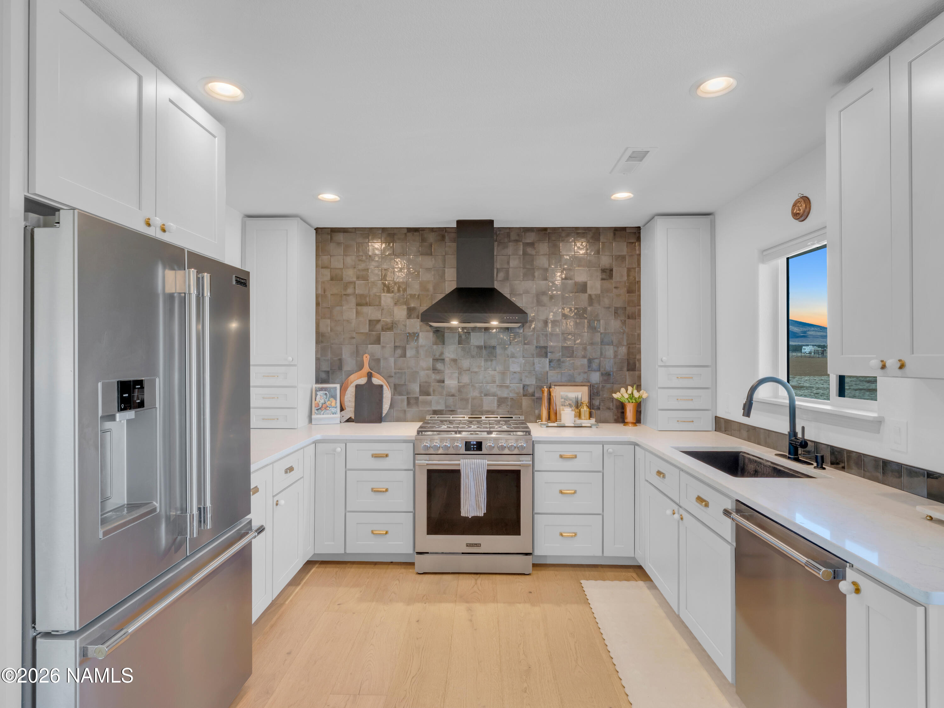 8115 Fawn Run Road Flagstaff, AZ 86004 - Photo 5 of 26 a kitchen with stainless steel appliances granite countertop a stove and a refrigerator