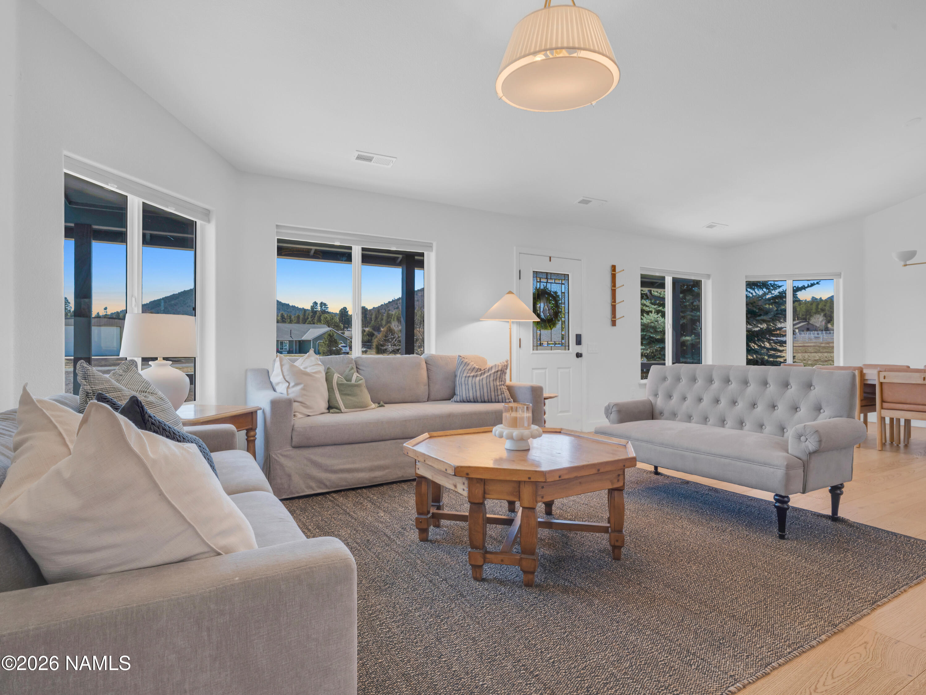8115 Fawn Run Road Flagstaff, AZ 86004 - Photo 9 of 26 a living room with furniture and a large window