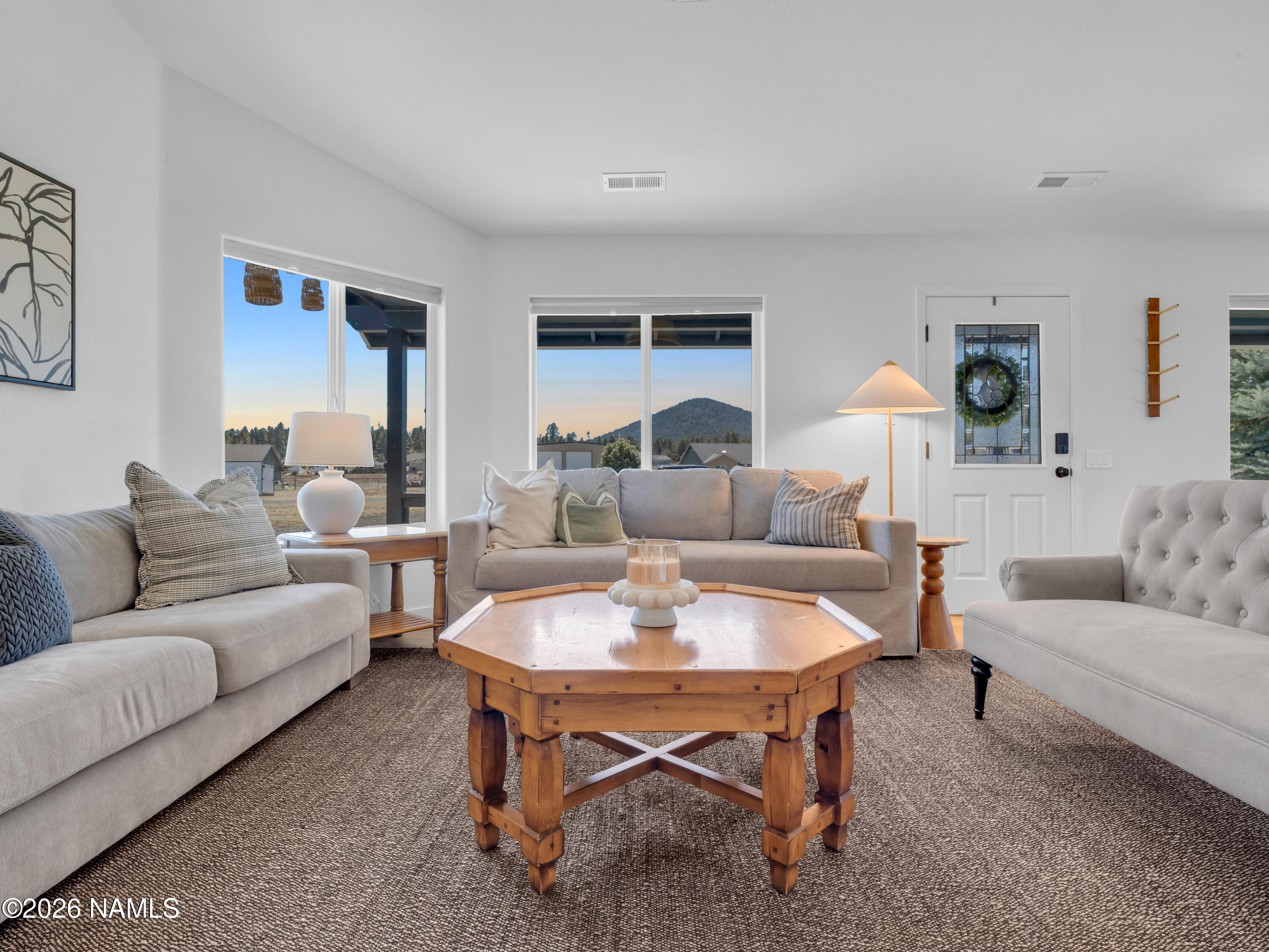 8115 Fawn Run Road Flagstaff, AZ 86004 - Photo 10 of 26 a living room with furniture and a table