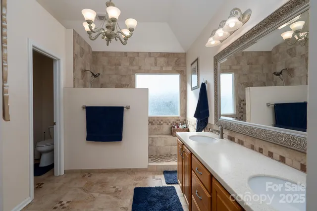 a bathroom with a sink a vanity and a mirror