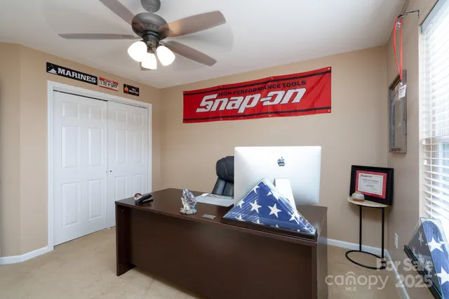 a view of a workspace with furniture