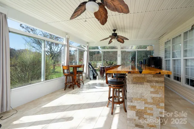 a view of a patio with a table chairs and a fireplace