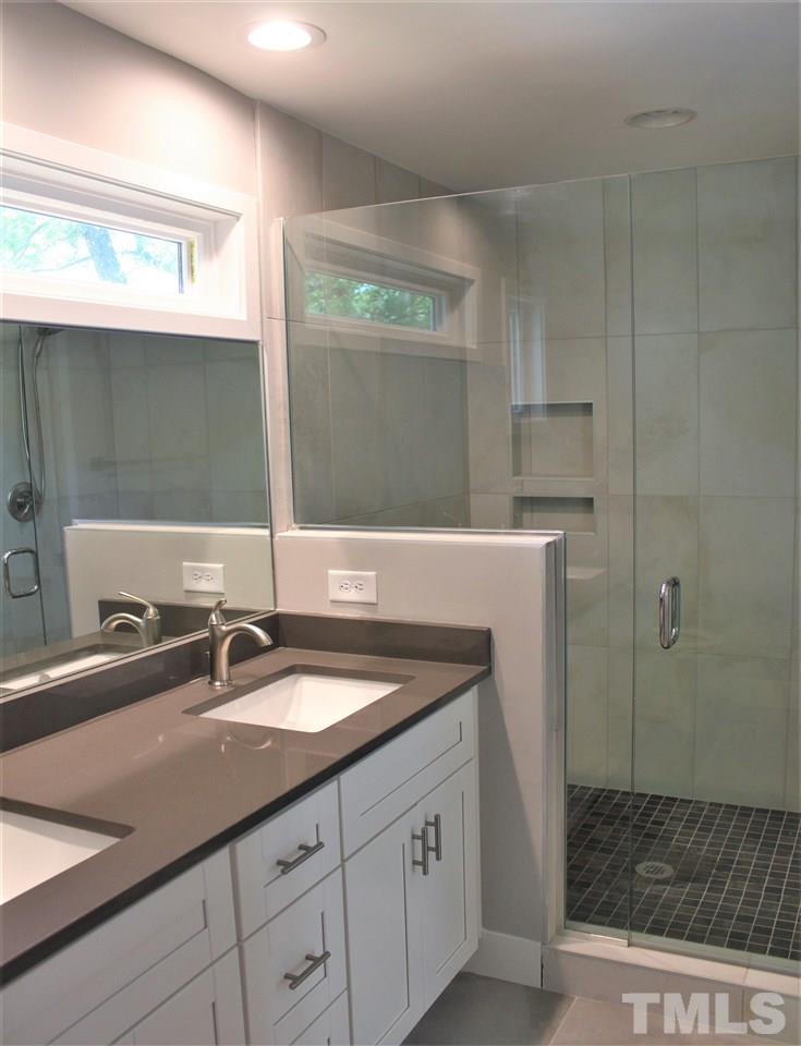 202 Parrish Street Raleigh, NC 27610 - Photo 8 of 14 Master bath with double vanity sinks, perfect natural light window.