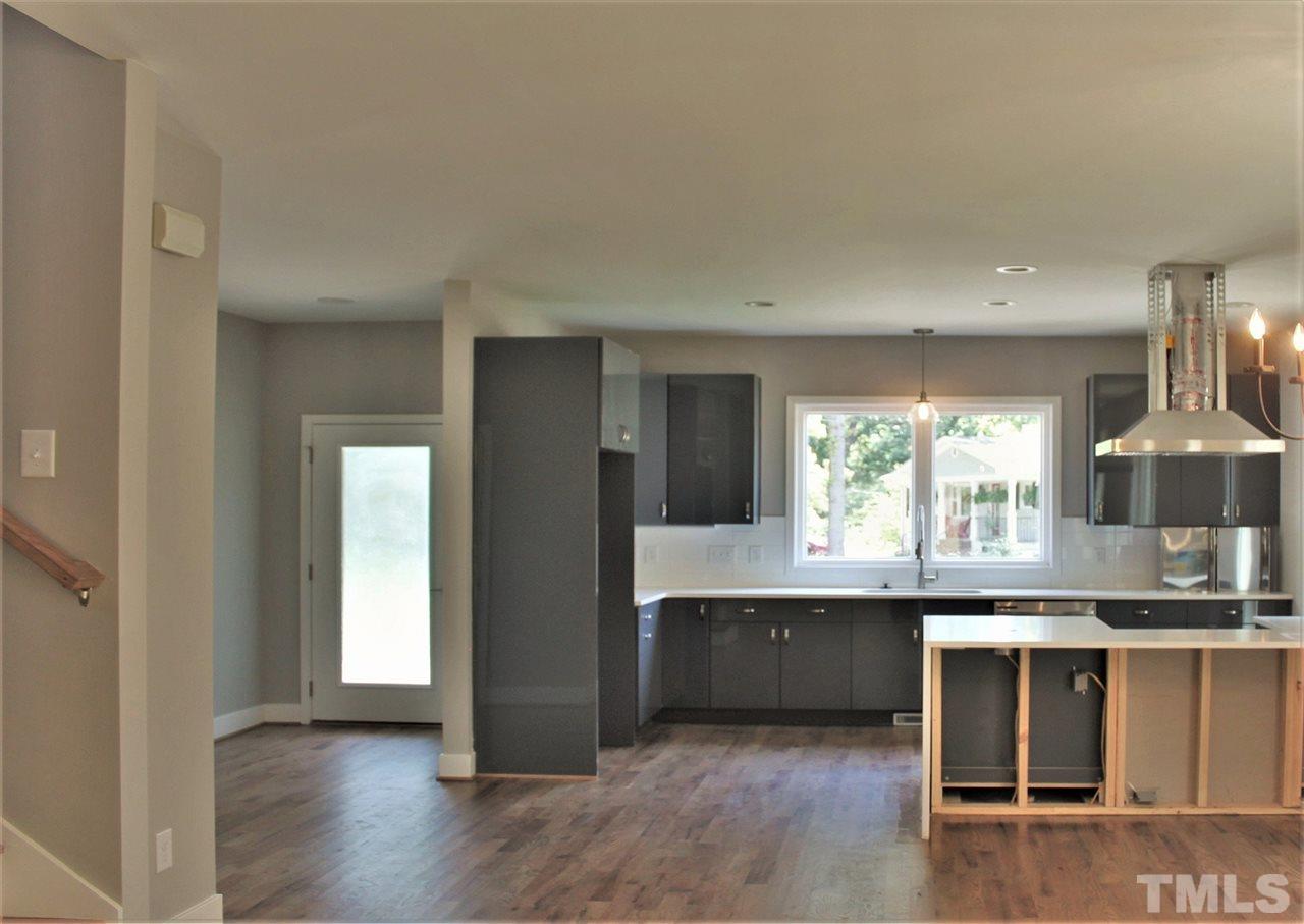 202 Parrish Street Raleigh, NC 27610 - Photo 10 of 14 Just a few more finishing touches for this fabulous open kitchen with gorgeous quartz countertops and custom cabinetry!