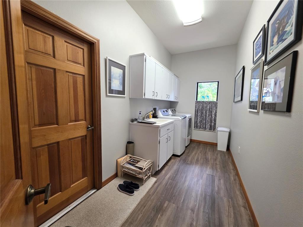 9446 Ashley Drive Weeki Wachee, FL 34613 - Photo 22 of 45 a kitchen with stainless steel appliances a refrigerator and a stove top oven