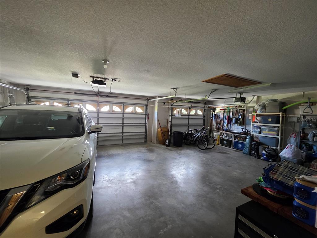 9446 Ashley Drive Weeki Wachee, FL 34613 - Photo 23 of 45 a view of a garage with cars