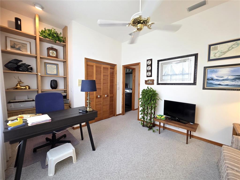 9446 Ashley Drive Weeki Wachee, FL 34613 - Photo 27 of 45 a view of a livingroom with workspace and a couch