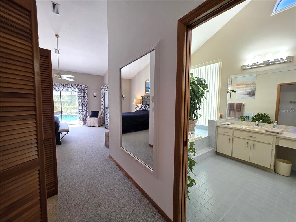 9446 Ashley Drive Weeki Wachee, FL 34613 - Photo 28 of 45 a bathroom with a tub a sink and mirror