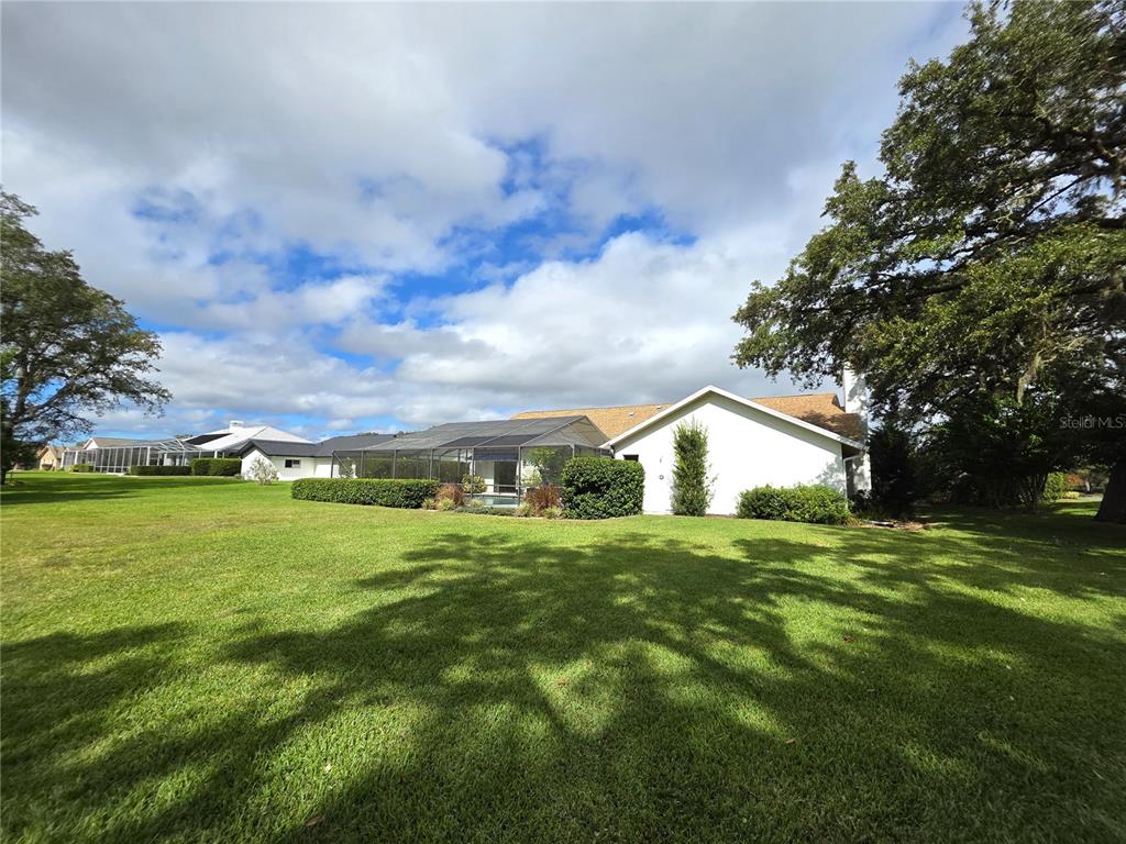 9446 Ashley Drive Weeki Wachee, FL 34613 - Photo 44 of 45 a front view of a house with a yard