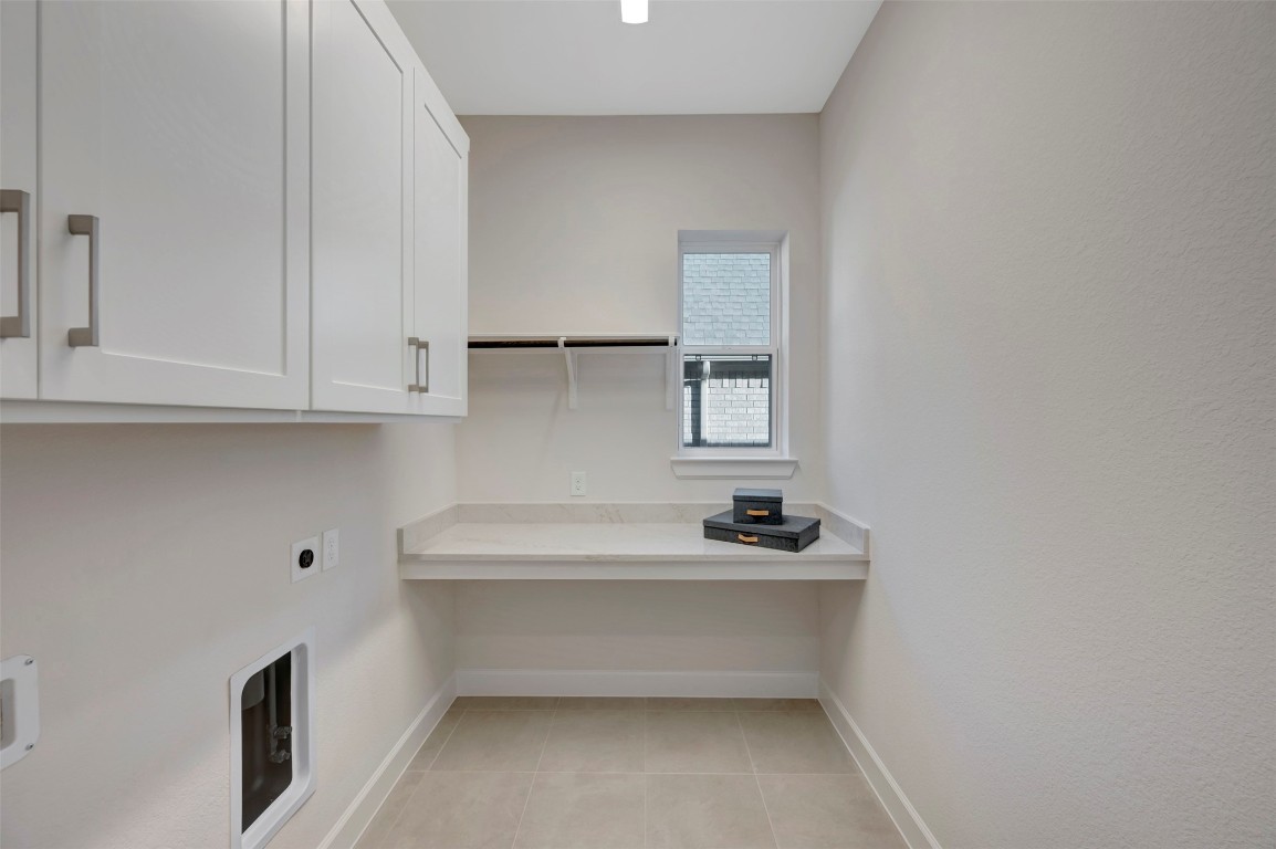 1728 Howler Way Montgomery, TX 77316 - Photo 23 of 42 Spacious utility room with upper cabinets and folding table