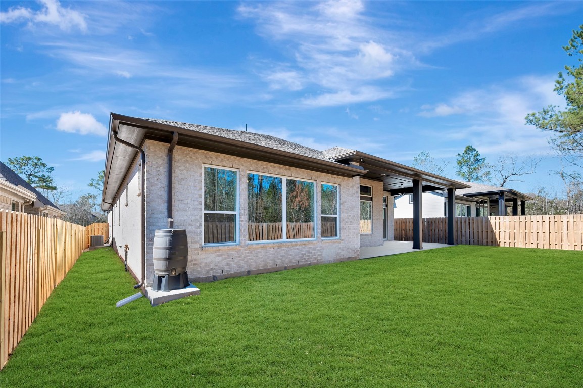 1728 Howler Way Montgomery, TX 77316 - Photo 29 of 42 Full gutters around home as well as patio is pre-wired for music speakers and camera. Plus I guess Line for future girl.