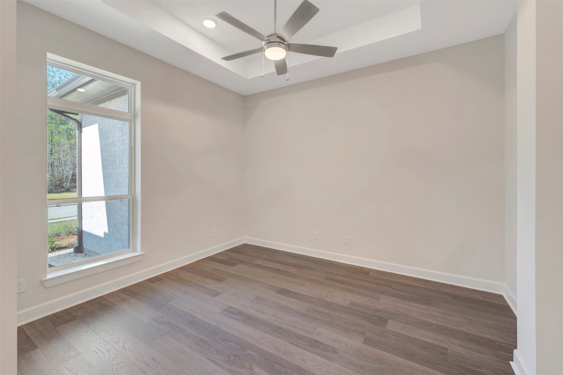 1728 Howler Way Montgomery, TX 77316 - Photo 7 of 42 Another view of study with ceiling fan and beautiful final plank flooring
