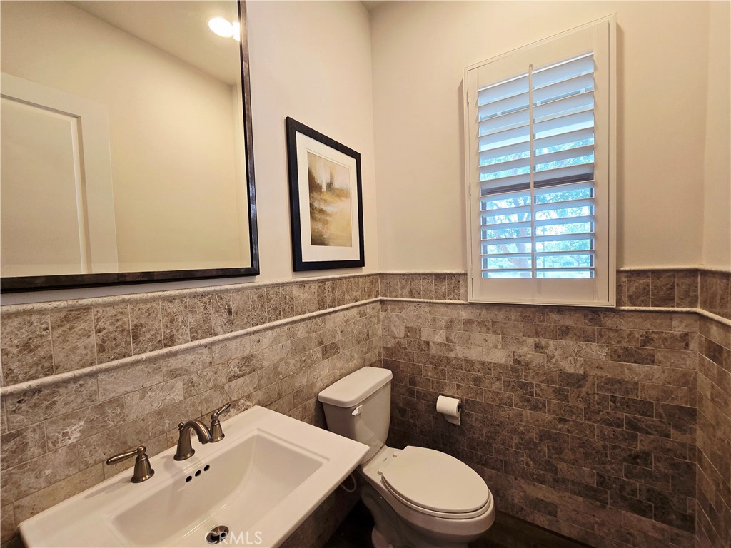 101 Newall Irvine, CA 92618 - Photo 15 of 24 a bathroom with a sink a toilet and a mirror