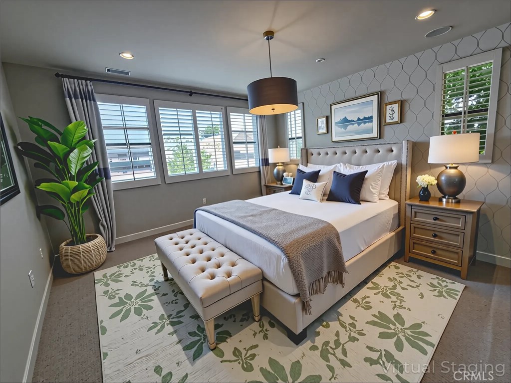 101 Newall Irvine, CA 92618 - Photo 18 of 24 a bedroom with a bed and a chandelier