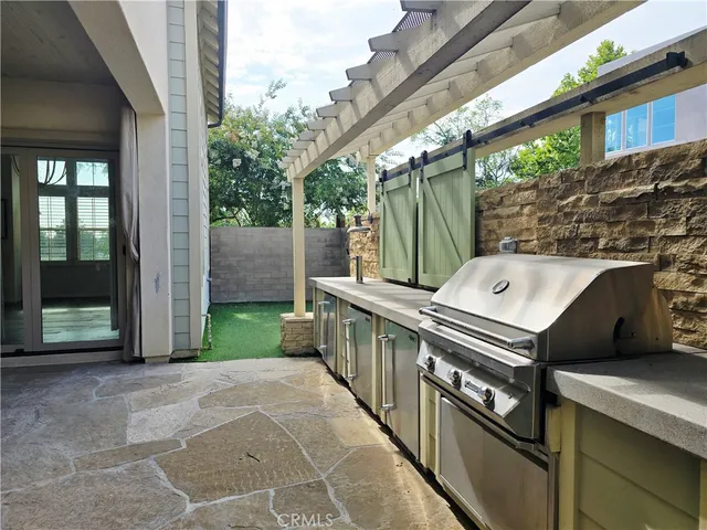 a view of a chairs and table in the balcony