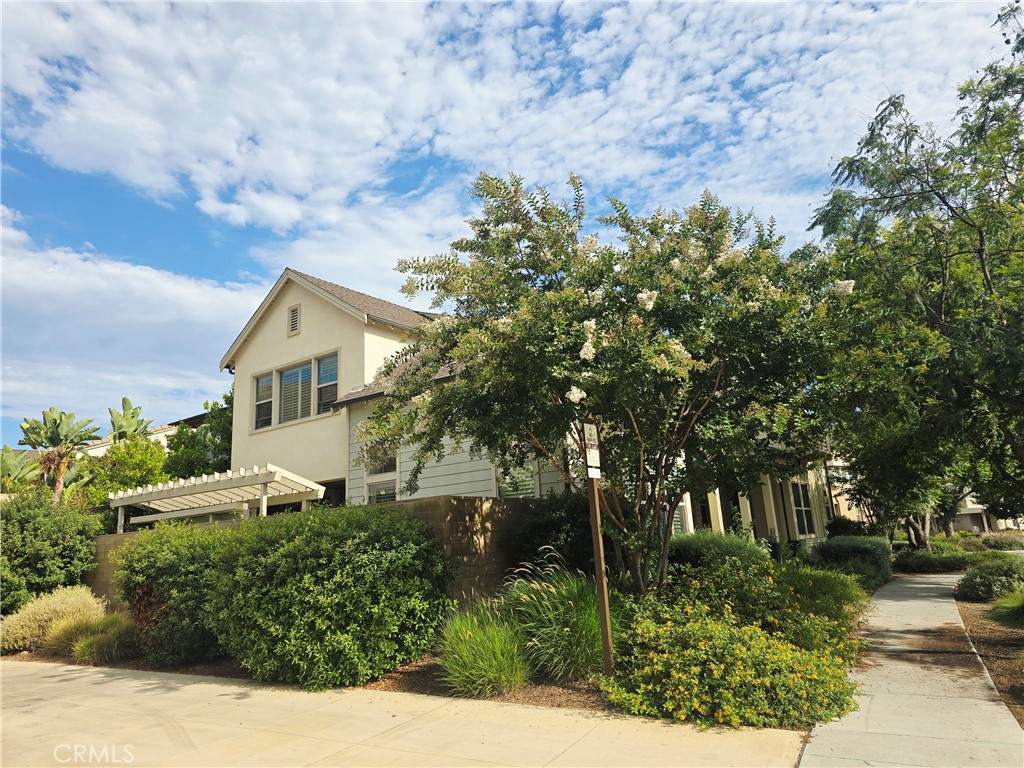 101 Newall Irvine, CA 92618 - Photo 3 of 24 a front view of a house with a yard and tree s