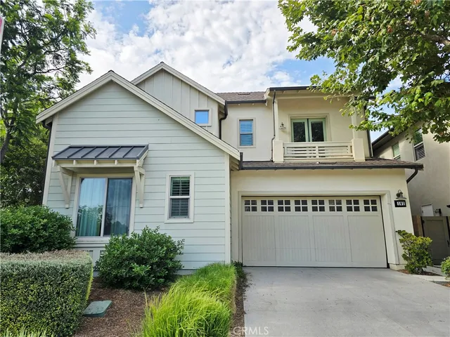 a sign that is sitting in front of a house