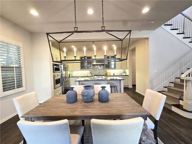 a dining room with a table or chairs and a potted plant