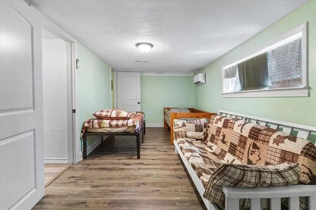 a bedroom with bed and window