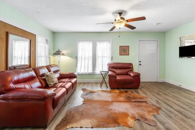 a living room with furniture and a window