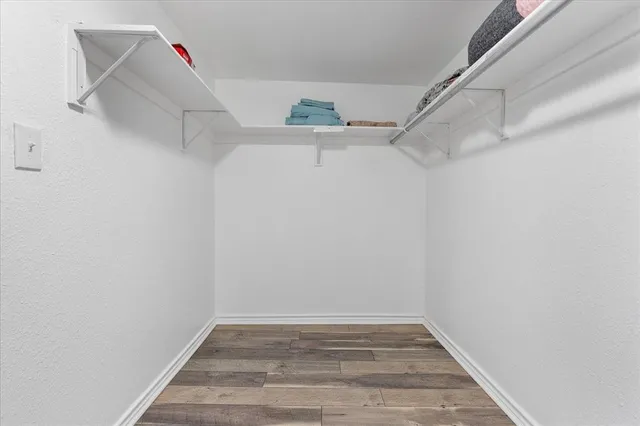 a view of a room with racks on the wall