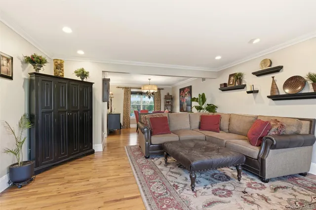 a living room with furniture and a rug