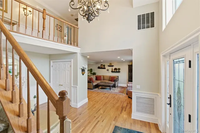 a view of a hallway with furniture and staircase