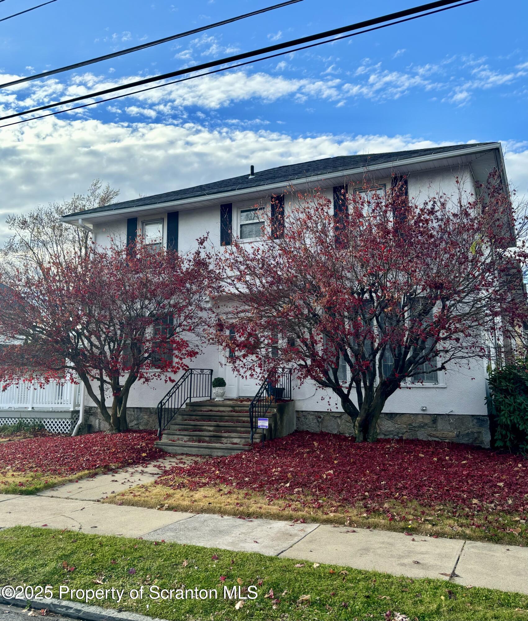 a view of house with yard