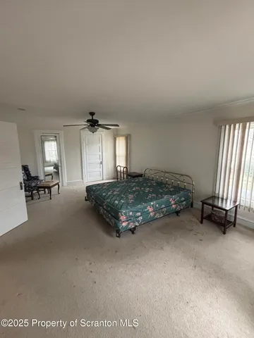 a bathroom with a sink a toilet a mirror and shower