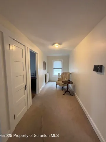 a view of a house with wooden deck