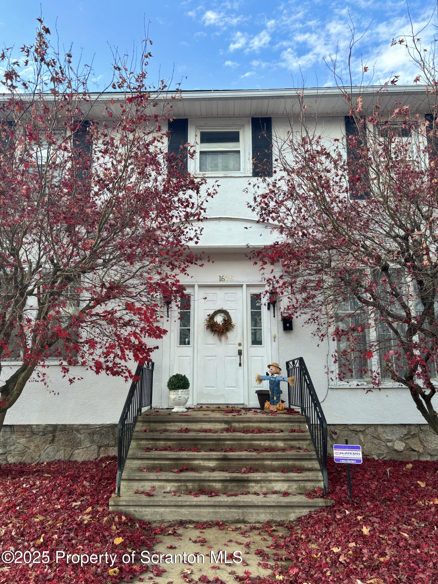 1625 Clay Avenue Dunmore, PA 18509 - Photo 2 of 17 a view of a white house with a potted plant and a large window