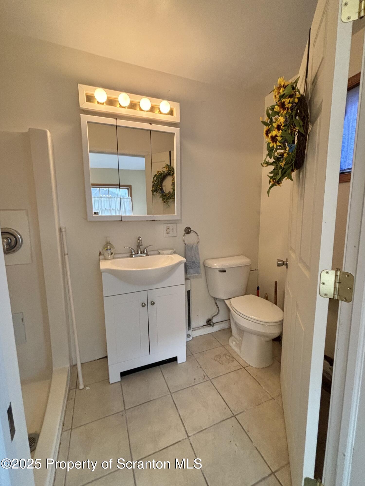 1625 Clay Avenue Dunmore, PA 18509 - Photo 9 of 17 a bathroom with a sink toilet and shower