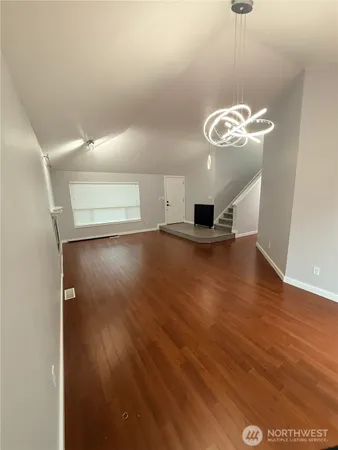 a view of a livingroom with wooden floor