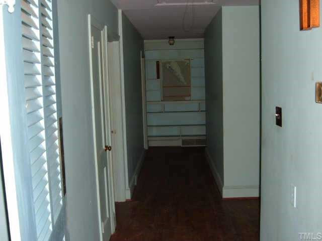 3420 Churchill Road Raleigh, NC 27607 - Photo 7 of 10 center hallway provides buffer between living areas and bed/bathroom areas of the home. Other