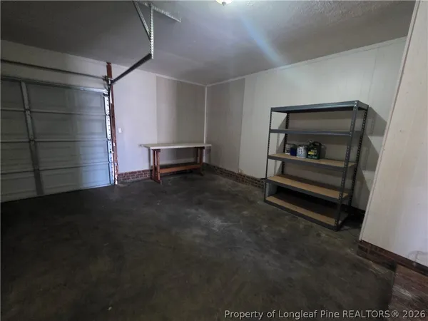 a view of room with racks and natural light