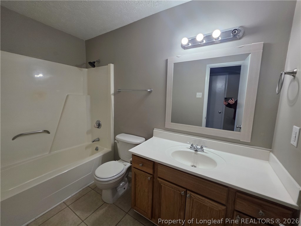 6536 Grist Mill Road Fayetteville, NC 28314 - Photo 14 of 23 a bathroom with a sink a toilet and shower
