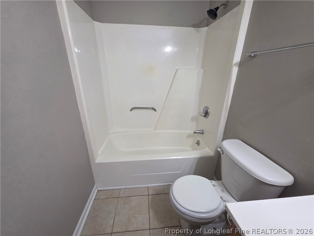 6536 Grist Mill Road Fayetteville, NC 28314 - Photo 16 of 23 a white toilet sitting next to a bath tub