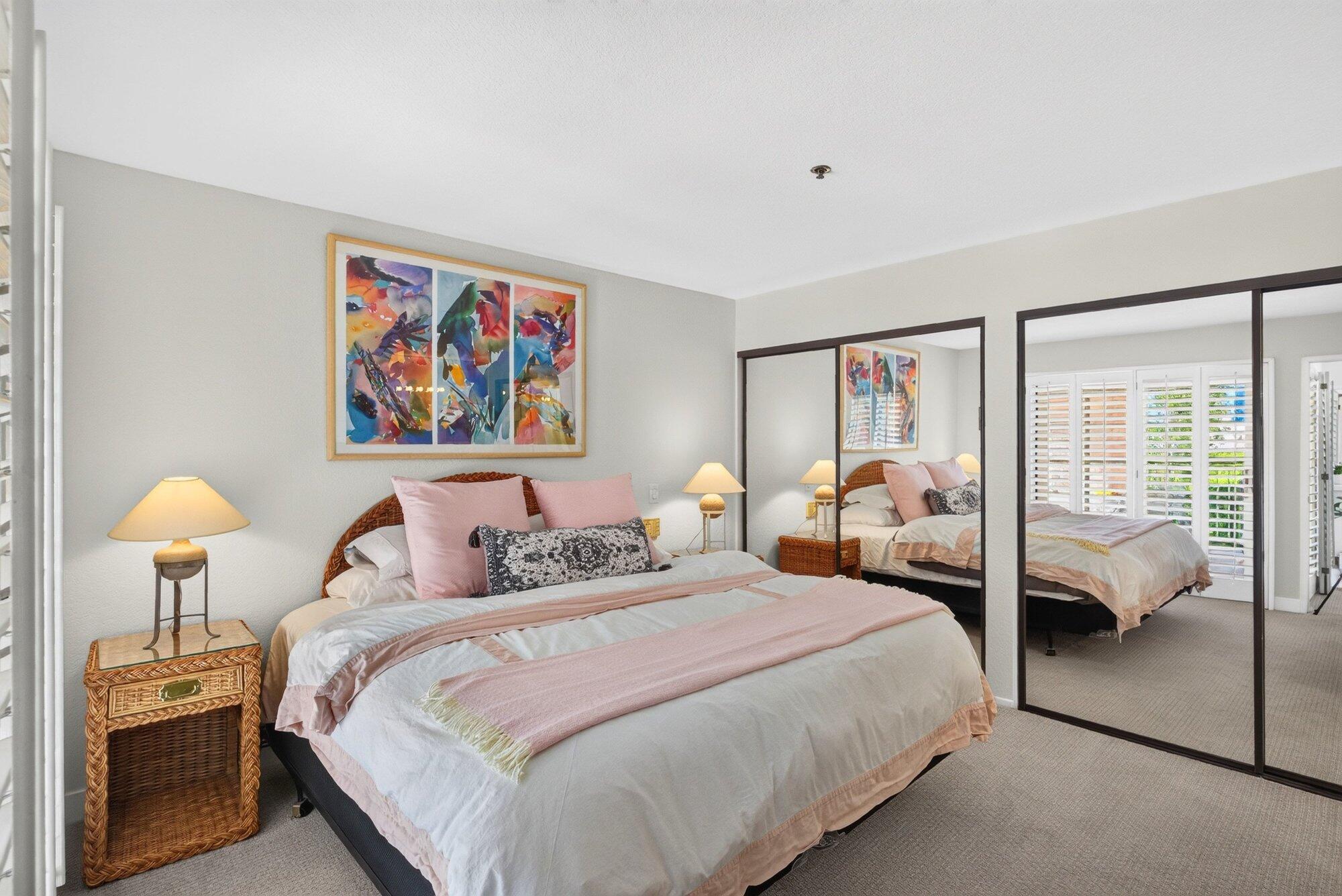 500 East Amado Road, Unit 313 Palm Springs, CA 92262 - Photo 11 of 32 a bedroom with bed and a night stand