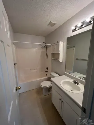 a bathroom with a double vanity sink toilet mirror and shower