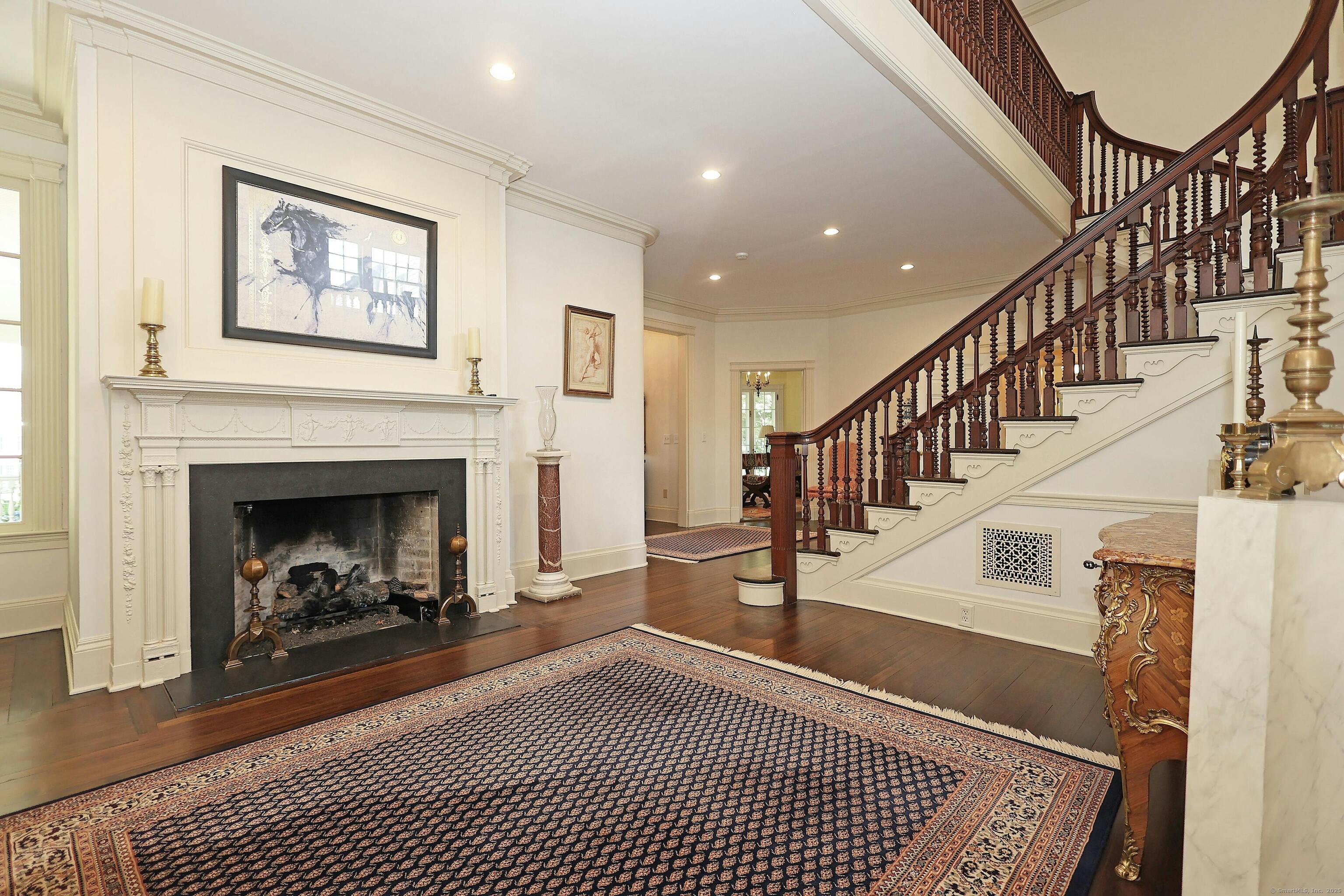 27 Country Club Road Ridgefield, CT 06877 - Photo 11 of 40 a living room with a fireplace and a rug