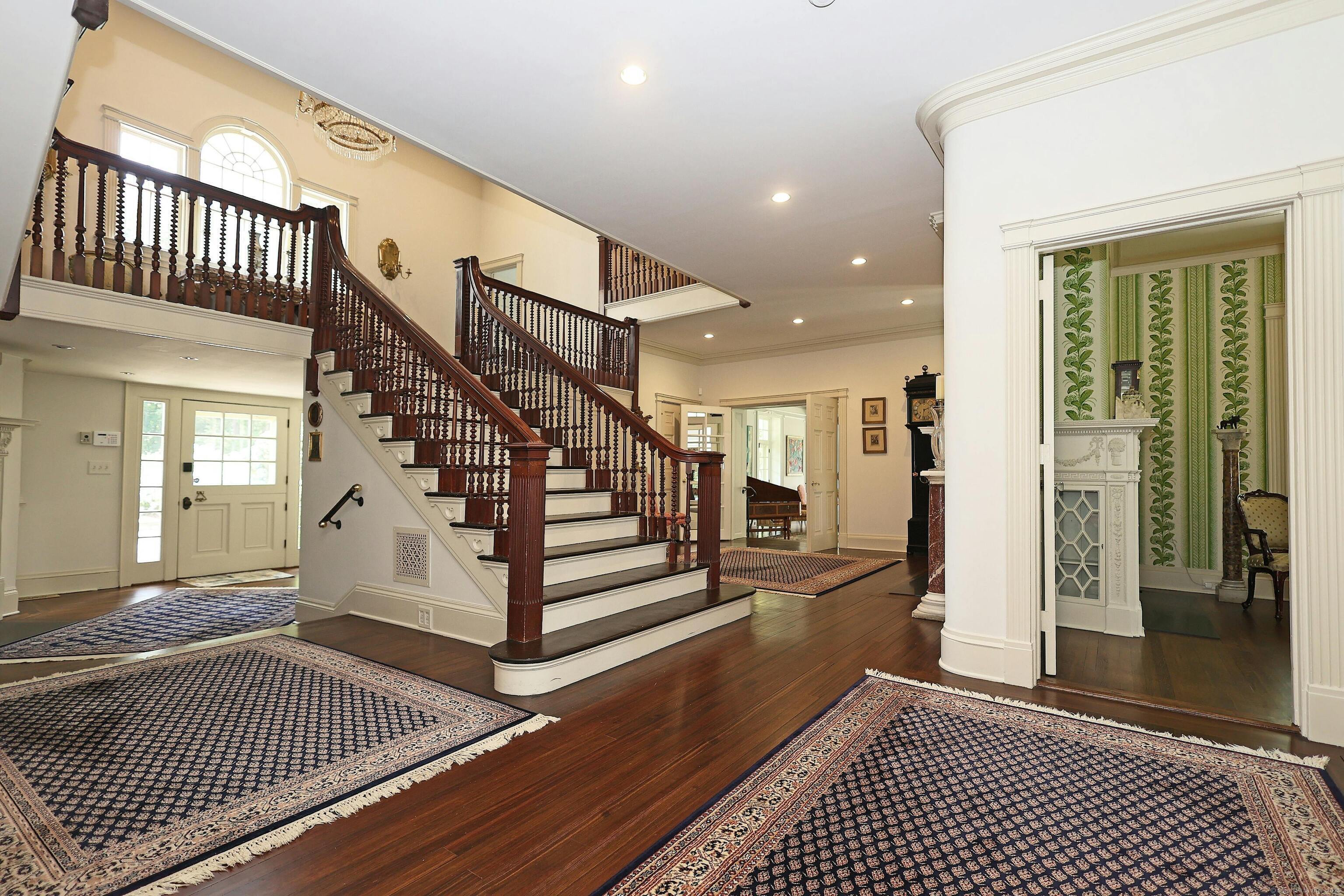 27 Country Club Road Ridgefield, CT 06877 - Photo 15 of 40 a view of a hallway with wooden floor and windows