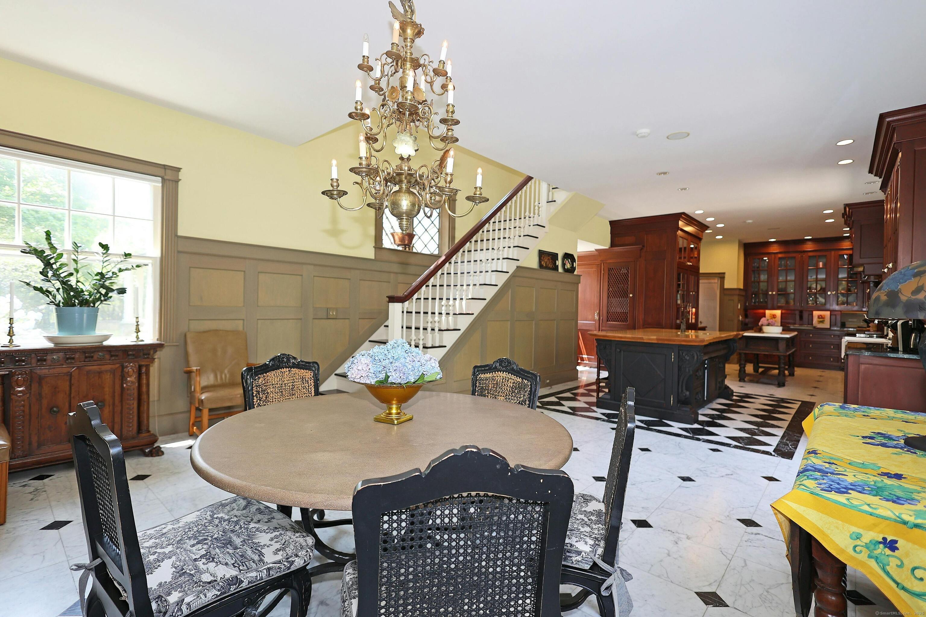 27 Country Club Road Ridgefield, CT 06877 - Photo 22 of 40 a view of a dining room with furniture and a chandelier