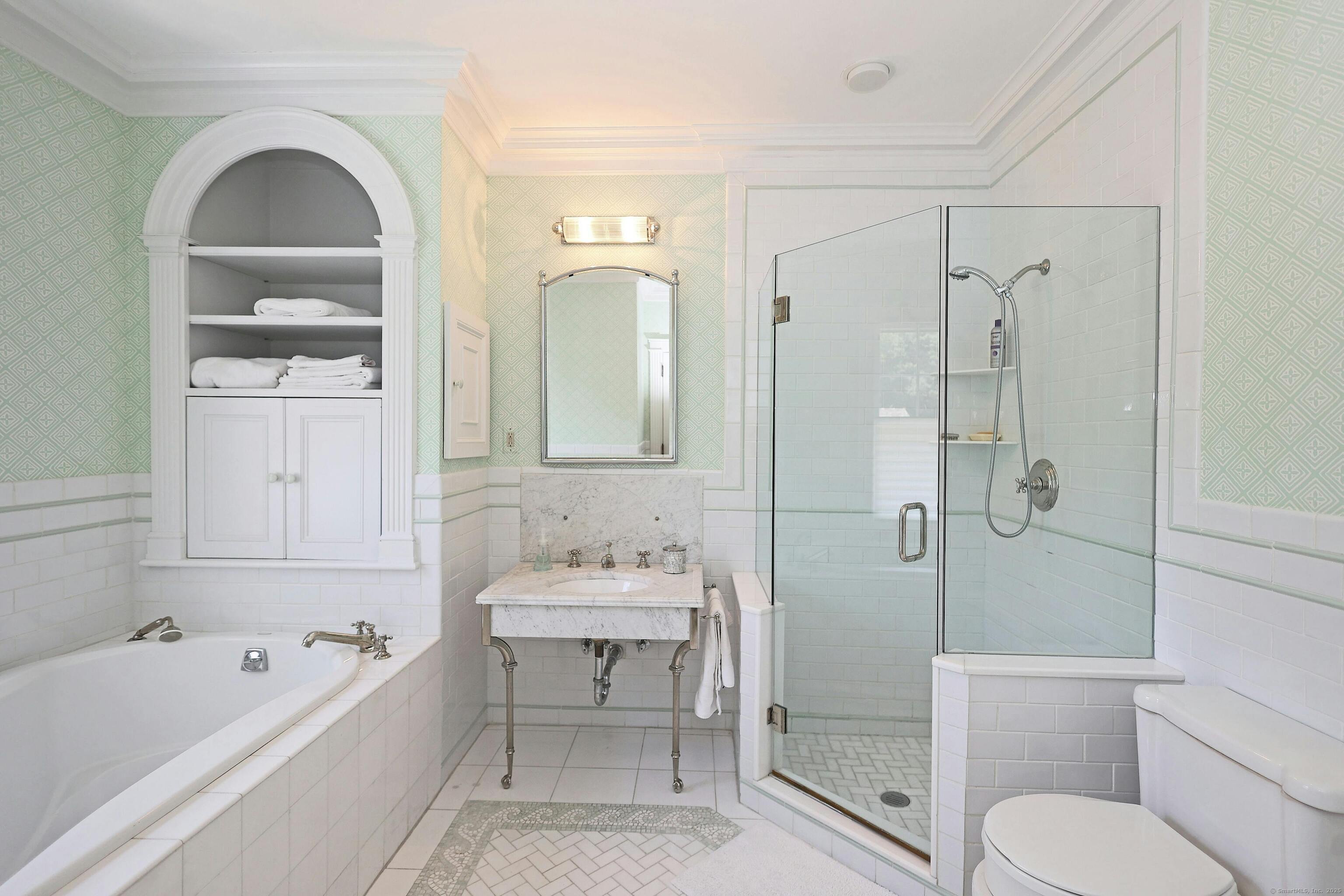 27 Country Club Road Ridgefield, CT 06877 - Photo 27 of 40 a bathroom with a toilet a sink a mirror a bathtub and shower