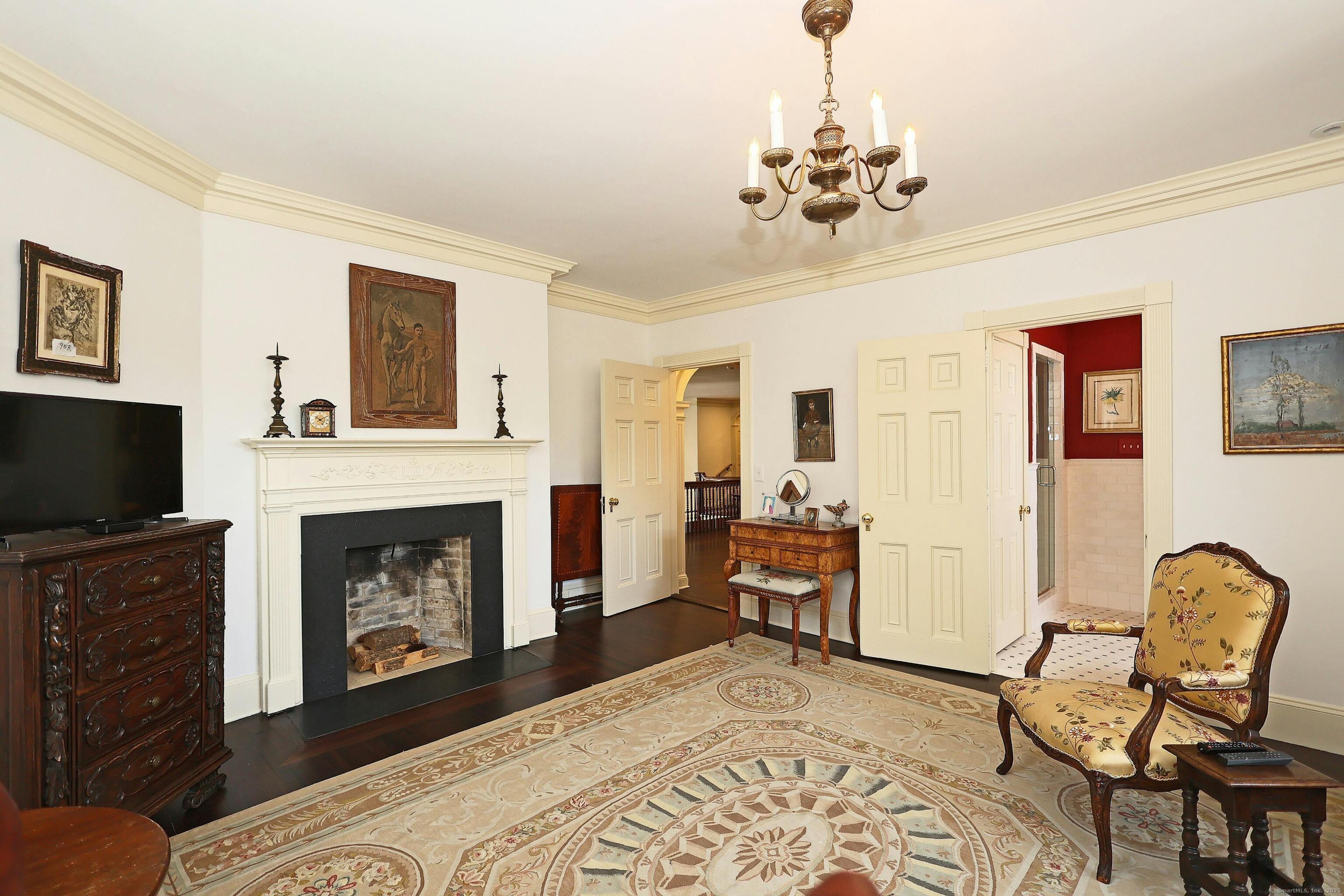 27 Country Club Road Ridgefield, CT 06877 - Photo 29 of 40 a living room with furniture a flat screen tv and a fireplace