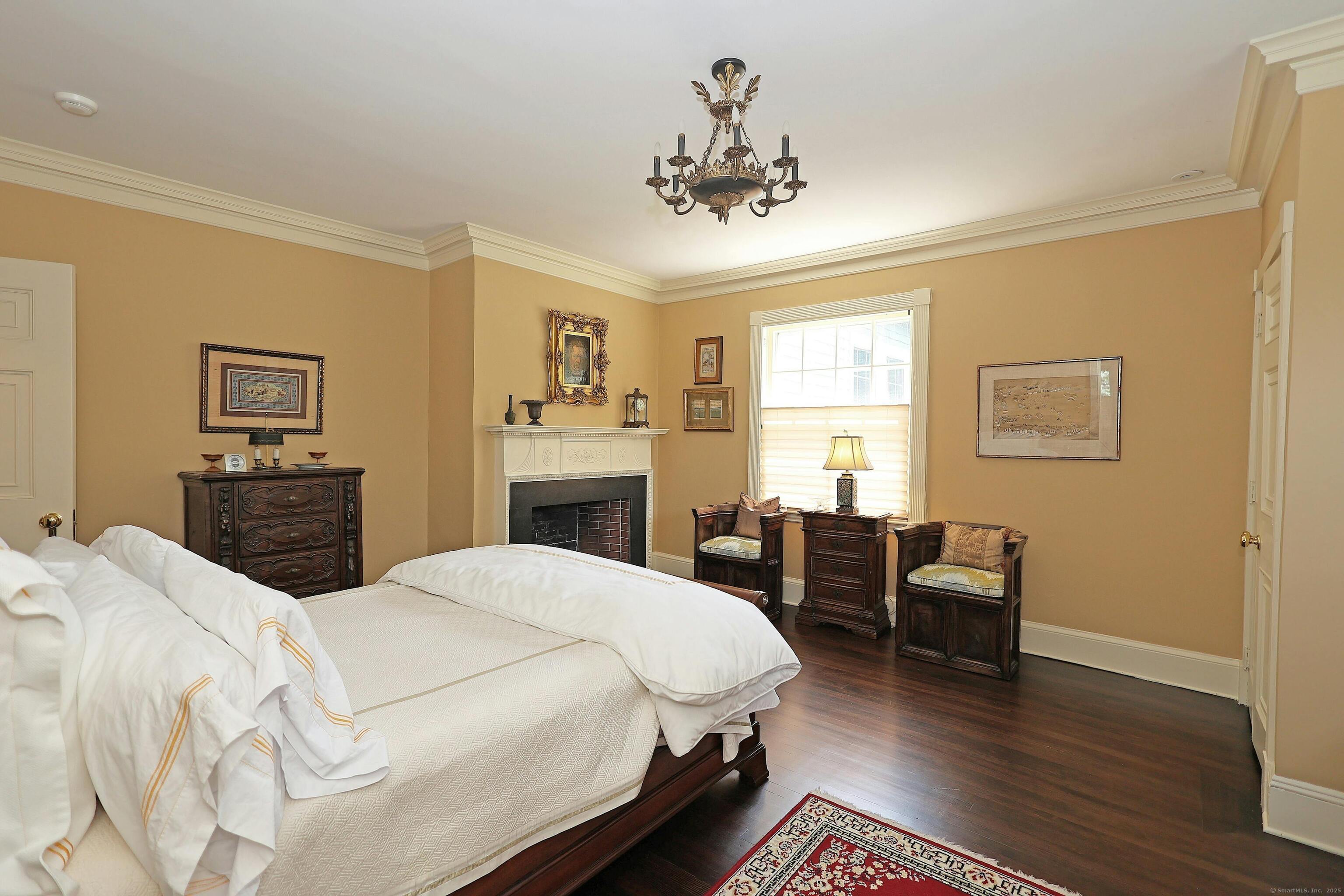27 Country Club Road Ridgefield, CT 06877 - Photo 30 of 40 a spacious bedroom with a bed and wooden floor