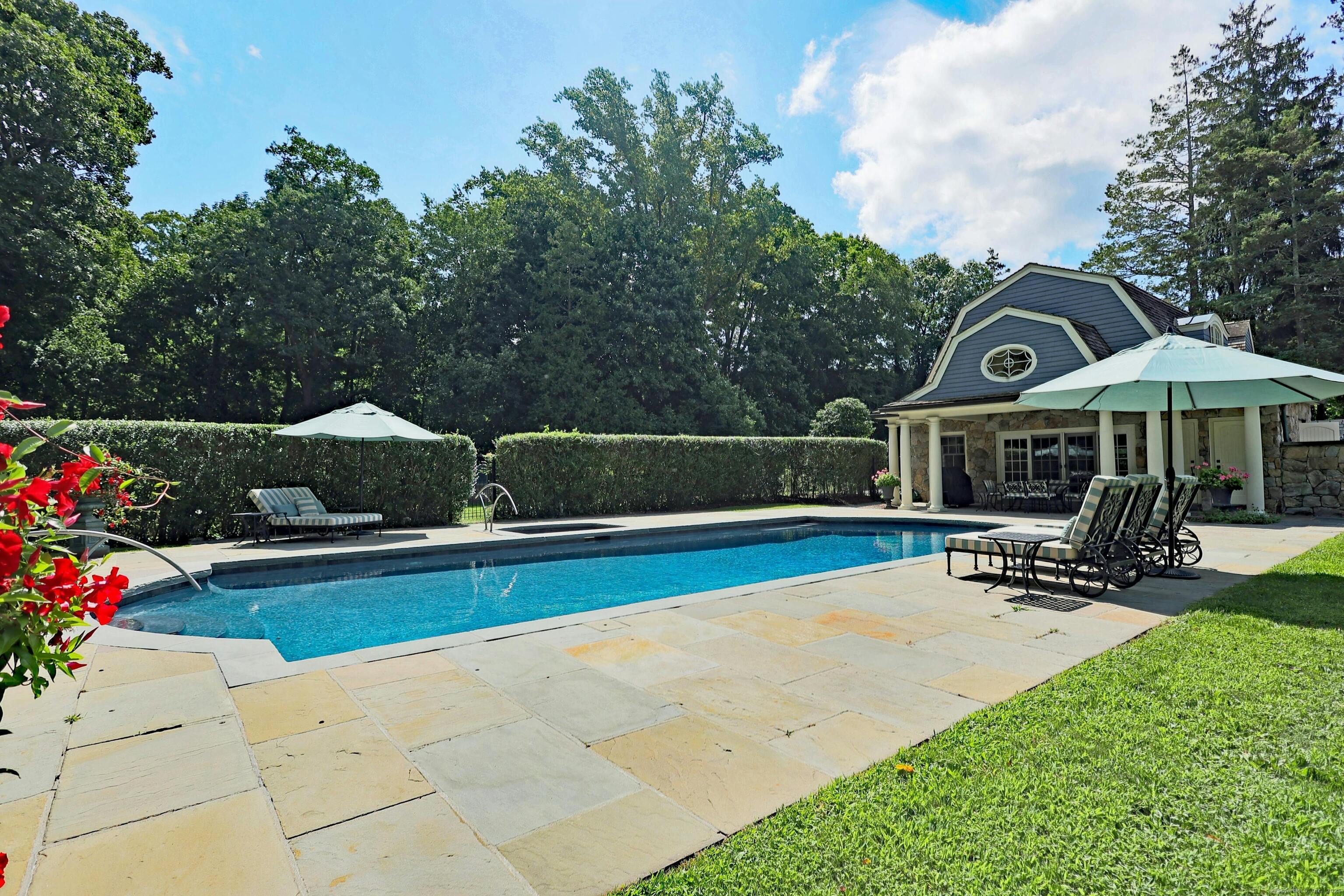 27 Country Club Road Ridgefield, CT 06877 - Photo 37 of 40 a front view of a house with patio
