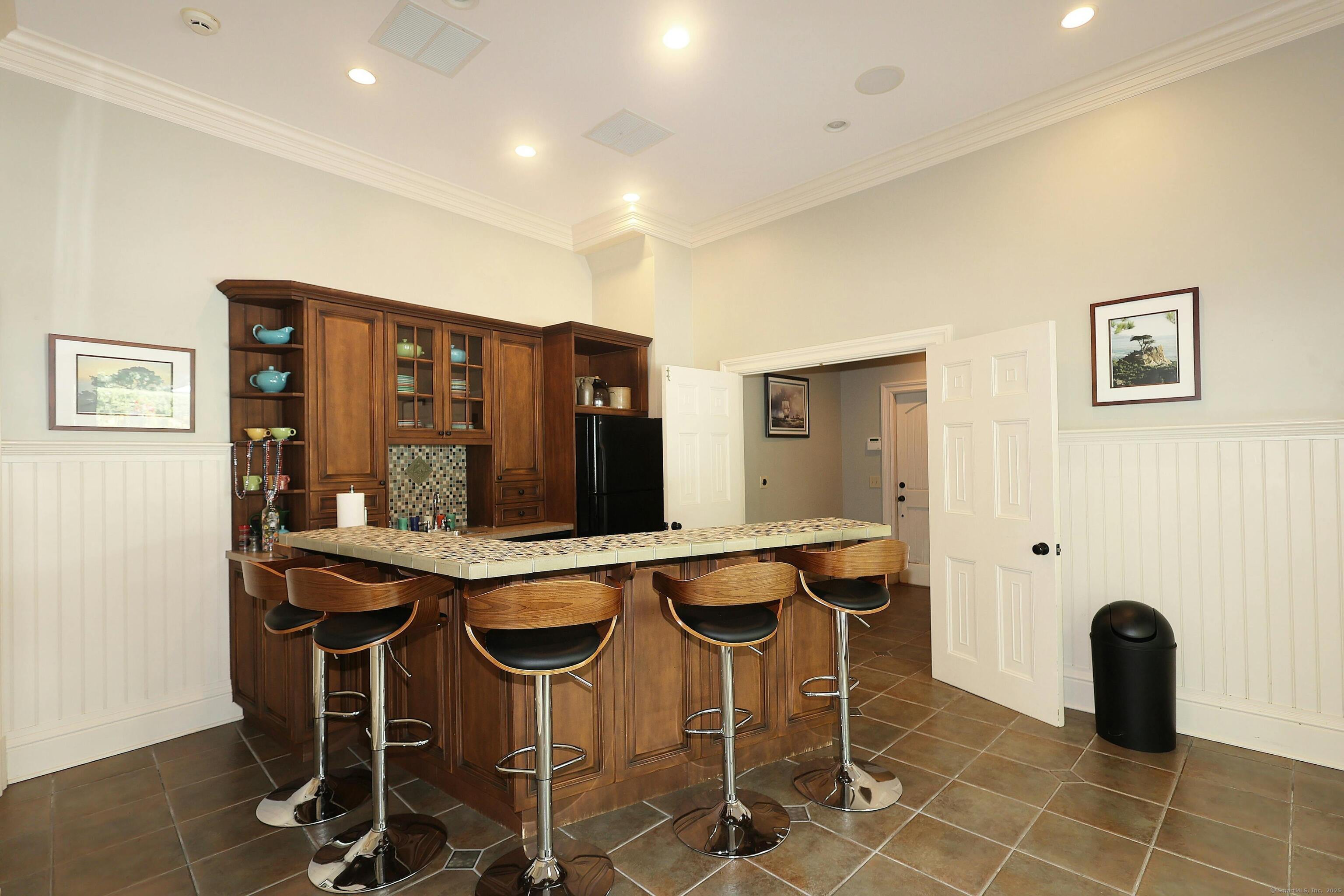 27 Country Club Road Ridgefield, CT 06877 - Photo 38 of 40 a view of a dining room with furniture