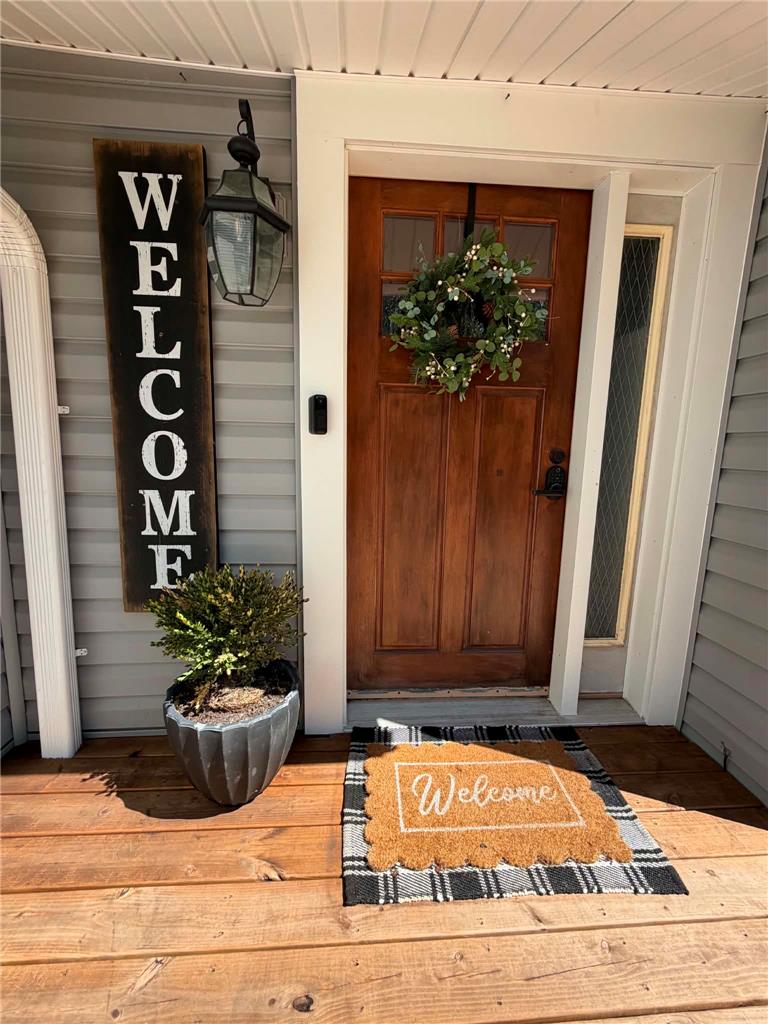 164 Sand Spring Road Cresco, PA 18326 - Photo 9 of 60 A warm wooden entry door and welcoming mat create inviting curb appeal.